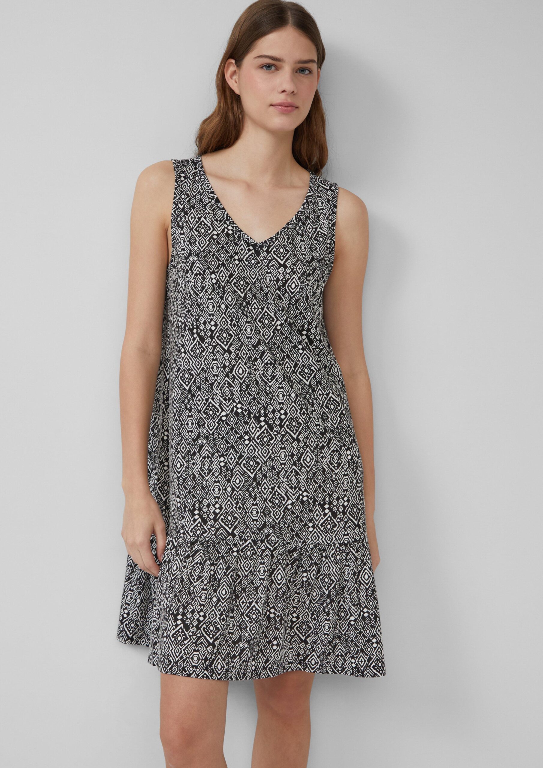 Korte jersey jurk met strikdetail op de rug